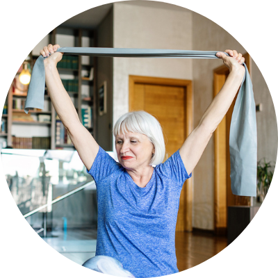 older woman using resistance band