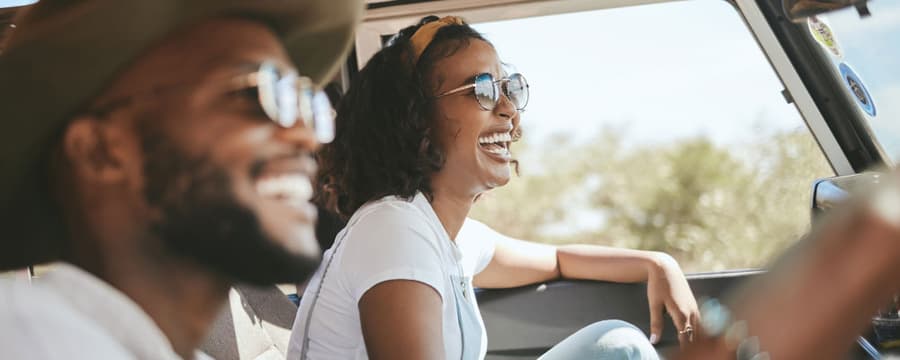 family driving on a cross country road trip