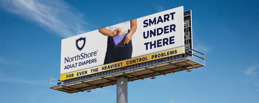 NorthShore billboard advertising adult diapers with bold text that reads 'Smart Under There' and a tagline for heavy incontinence protection.