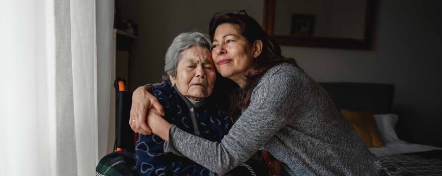 a caregivers embrace with the one their caring for