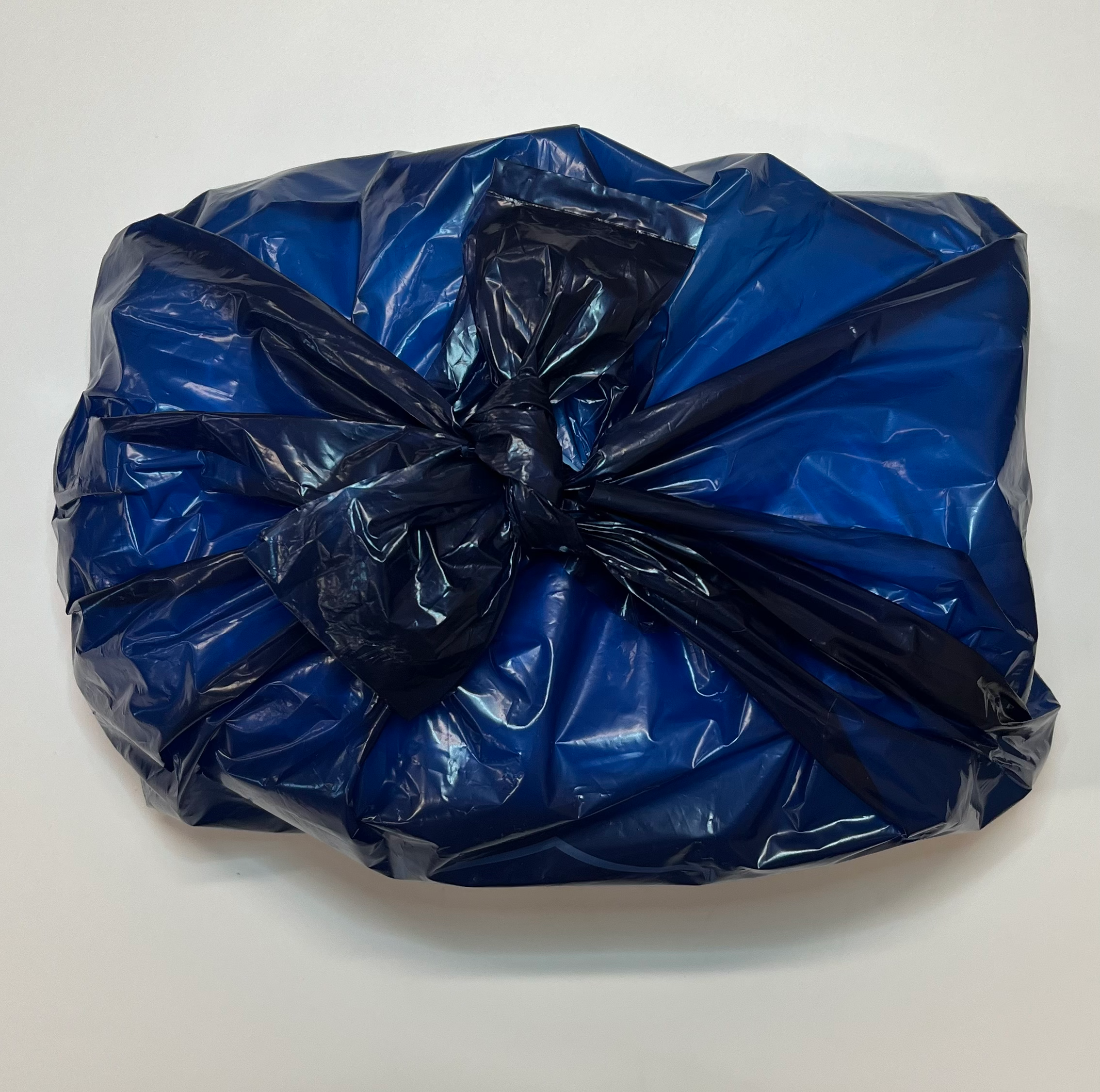 Handles of DiscreetShield adult diaper disposal bag