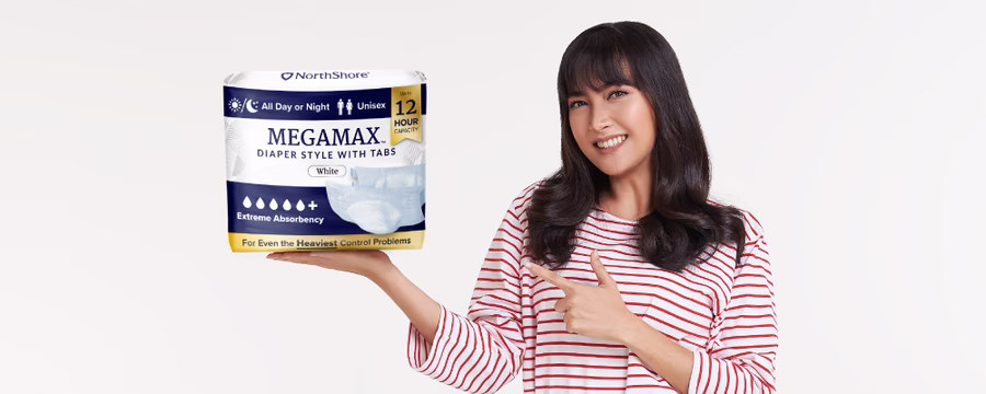 woman holding packaging of northshore megamax adult tab style diapers