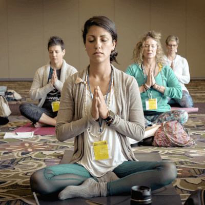 group of women on the floor in yoga position