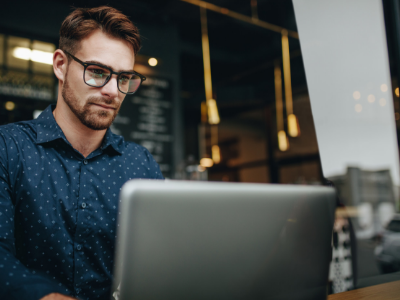 young man on laptop at work