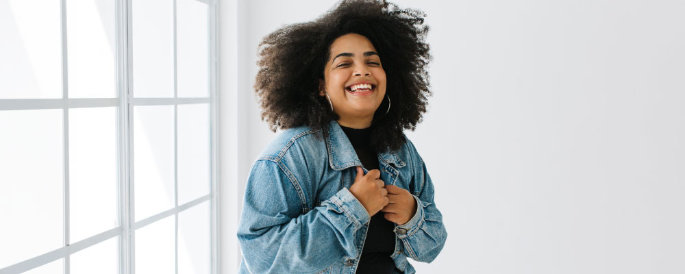 woman expressing relief from conquering leaks from incontinence