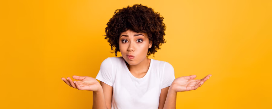 woman shrugging shoulders between the differences of incontinence briefs