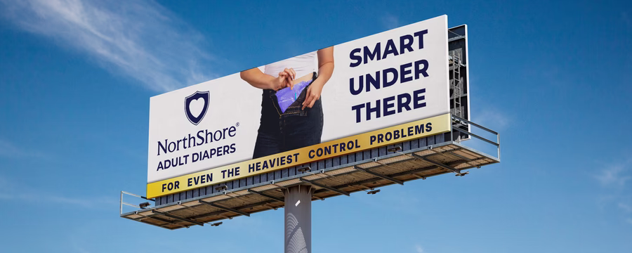 NorthShore billboard advertising adult diapers with bold text that reads 'Smart Under There' and a tagline for heavy incontinence protection.