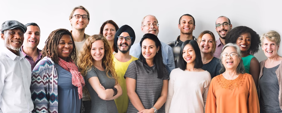 A diverse group of smiling people representing different ages and backgrounds, illustrating key statistics and facts about incontinence.