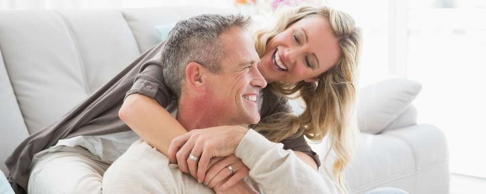 mature couple hugging at home