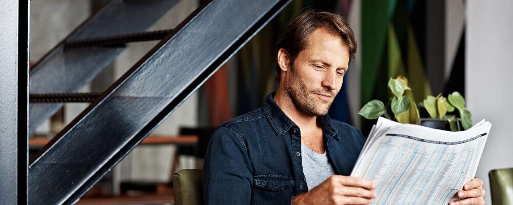 man reading newspaper