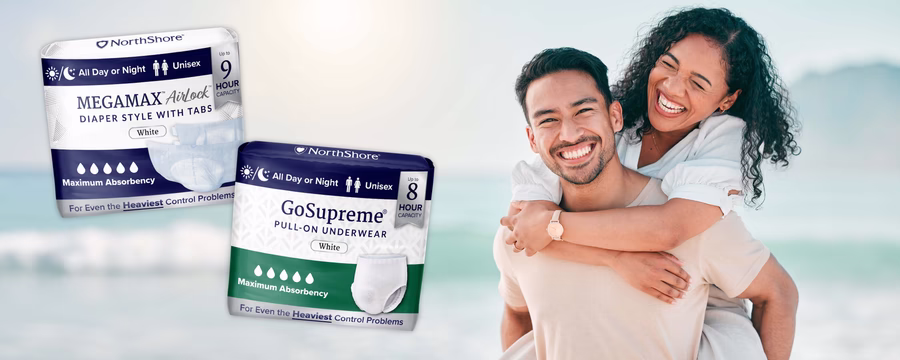 Happy couple enjoying beach day with NorthShore GoSupreme and MEGAMAX AirLock incontinence products