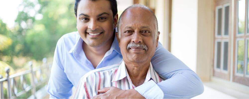 man and senior father outside on patio