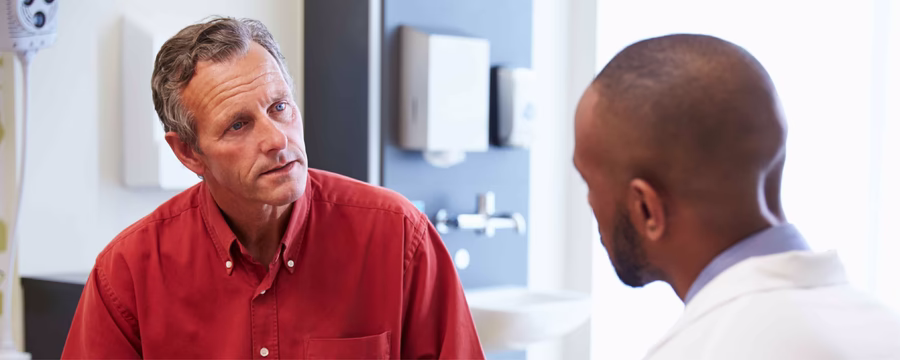man meeting with doctor after prostate treatment