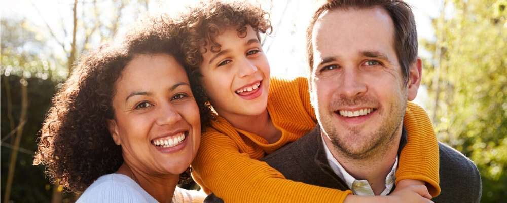 parents smiling with child