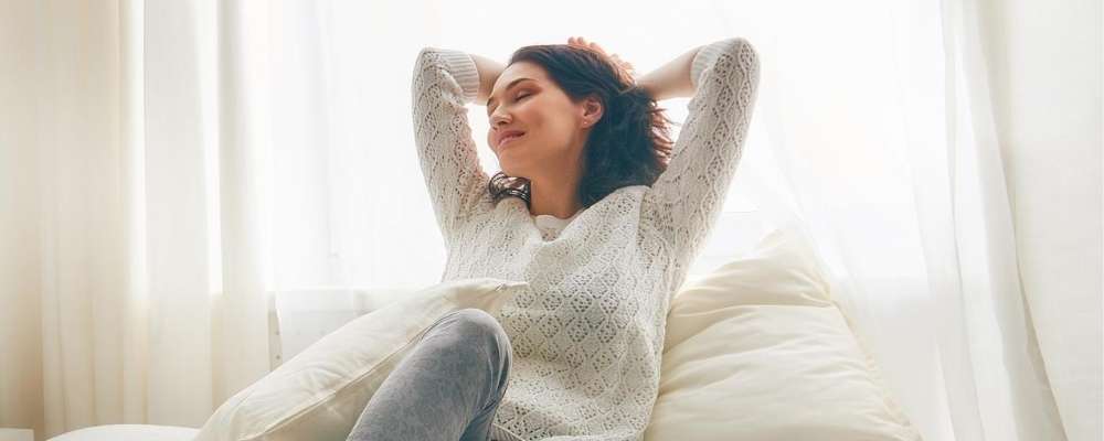 woman waking up happy