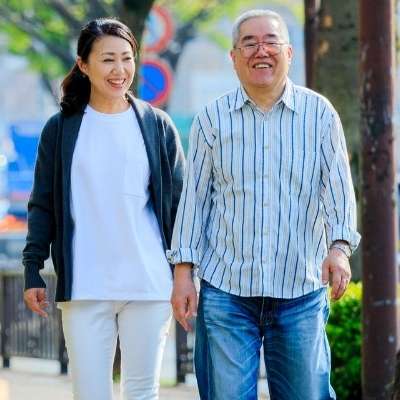 woman helping elderly man