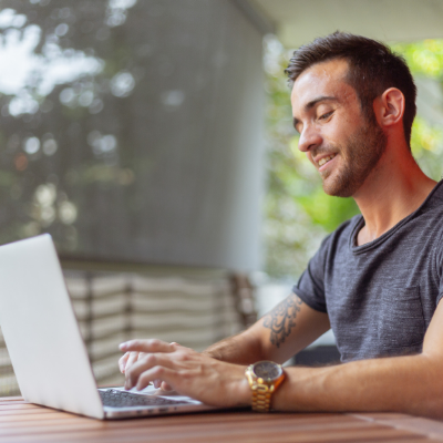 man researching on laptop