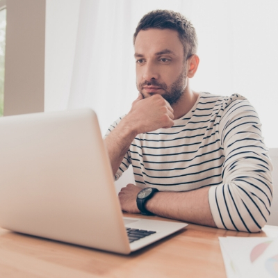 man looking at laptop screen