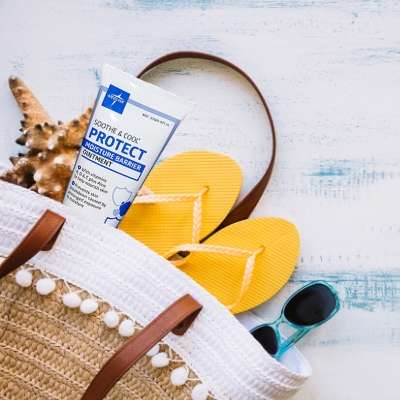 Soothe & Cool Moisture Barrier lotion with flip flops
