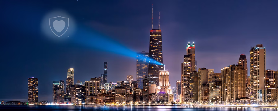 Chicago skyline with NorthShore heart shield spotlight symbolizing protection and strength.