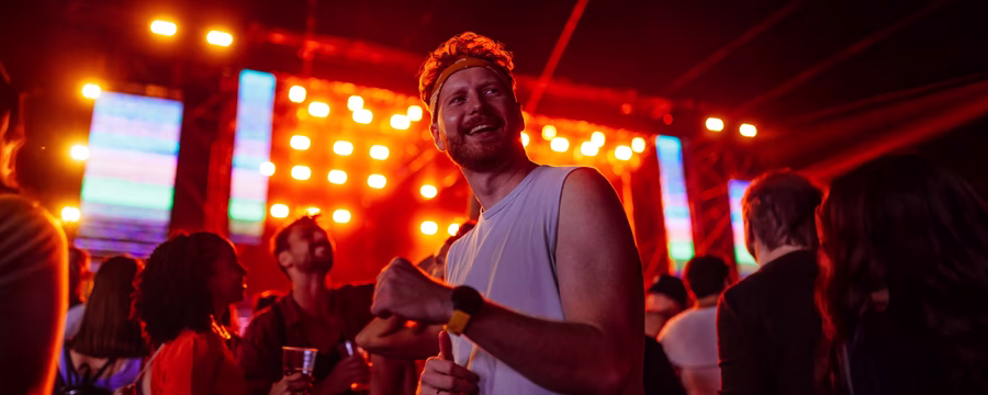 Man enjoying concert symbolizing courage and confidence NorthShore