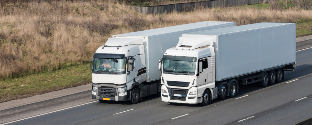 two semi-trucks on road