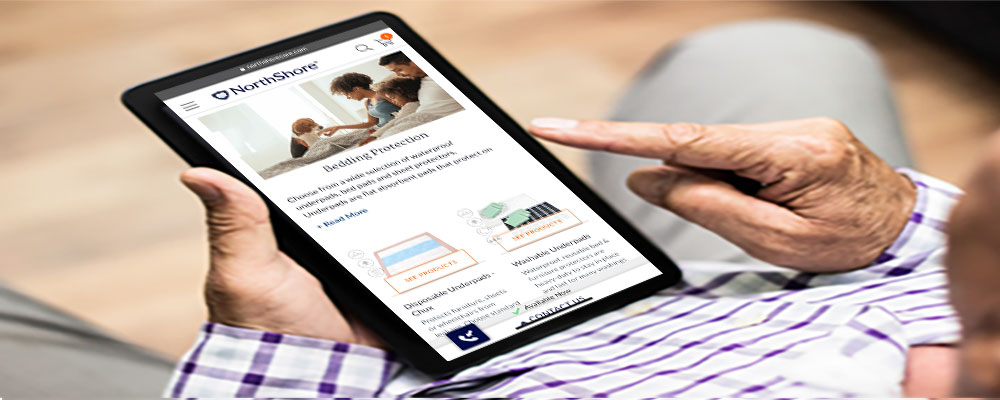 Man on tablet looking at NorthShore website