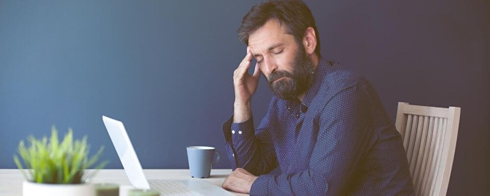 mature man stressed while managing incontinence